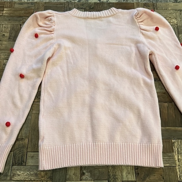 Pink V Neck Sweater With Puff Sleeves and Red Pom Poms - Picture 11 of 11